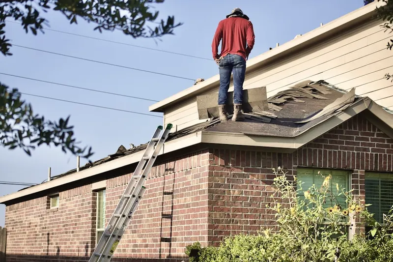 Professional roofer working on a residential roof in California Summit